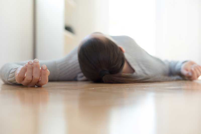 Woman passed out on floor