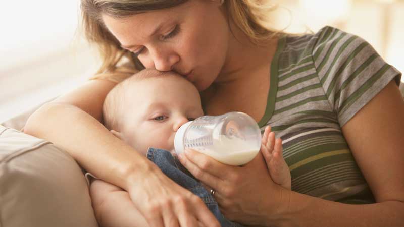 baby drinking from a bottle