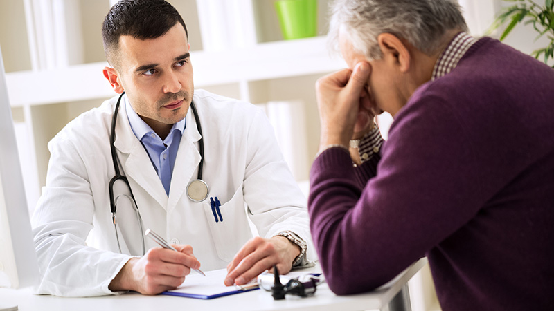 man talking to doctor