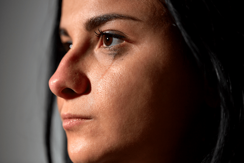 close up of a crying woman