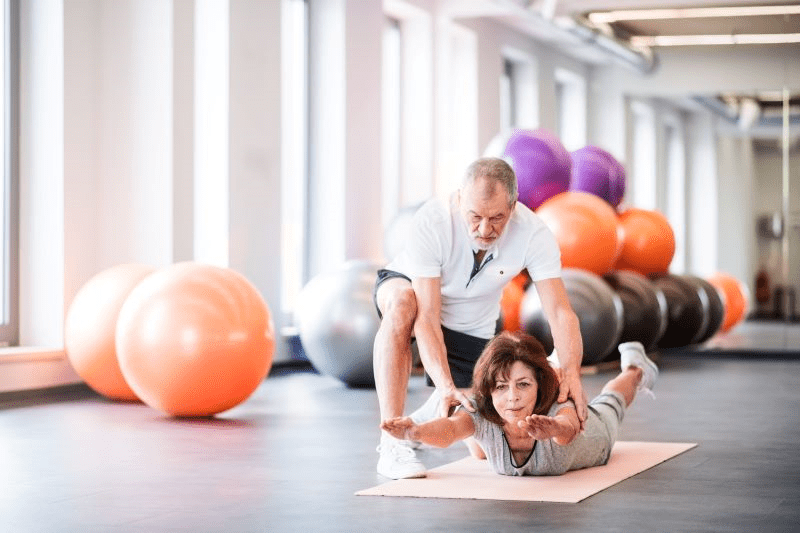 Senior physical therapist working with a patient