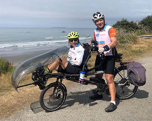 Debra and Steve riding on a tandem bike