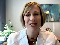 Tracy E. Madsen, MD, PhD talking on a video call from her office Tracy E. Madsen, MD, PhD talking on a video call from her office