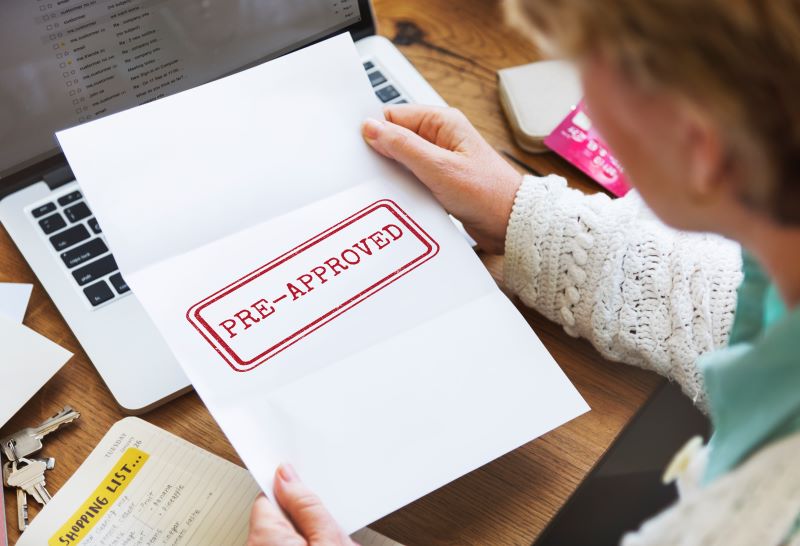 Person holding a pre-approved stamped piece of paper