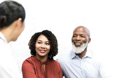 Black couple talking to a healthcare professional Black couple talking to a healthcare professional