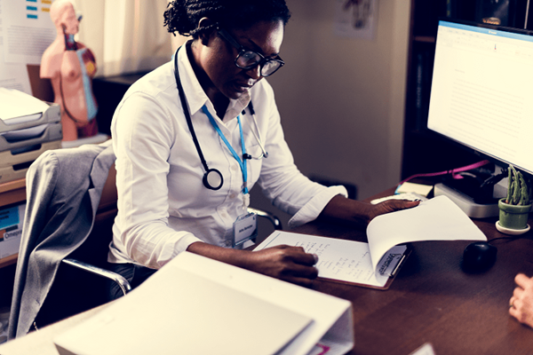 Doctor looking at Paperwork