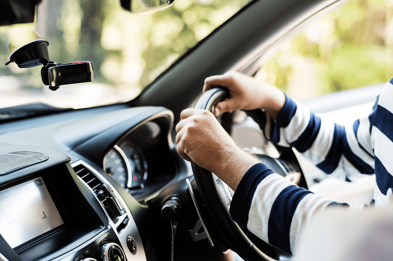 man driving a car